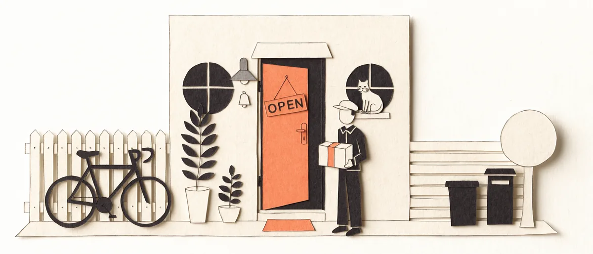 A paper-cut diorama of the studio's front door: a Clay door standing open in a cream facade under a small awning, a hanging OPEN sign, a wall lamp and a bell, two potted plants and a doormat below it, a cat sitting in the round window beside it, and a courier in a cap on the step holding a parcel tied with Clay tape.